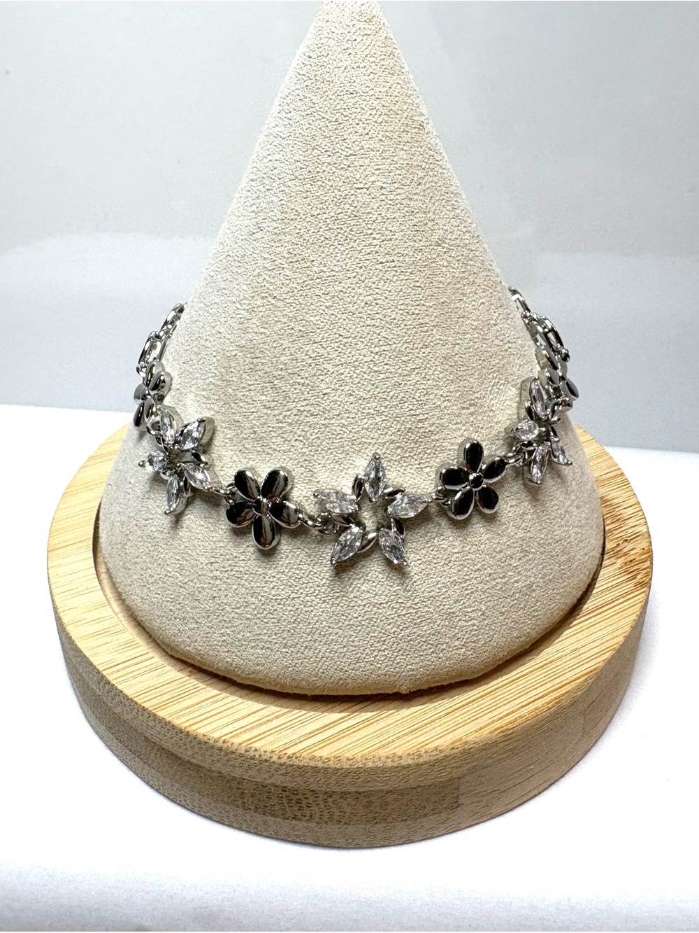 White Gold Plated Silver Floral Crystal Bracelet - With Interlocking Hearts.